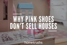 A pink shoes on top of a table